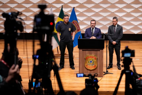 Federal police director Andrei Passos speaks during a news conference regarding an explosion outside the Supreme Court, in Brasilia, Brazil, Thursday, Nov. 14, 2024. (AP Photo/Eraldo Peres)