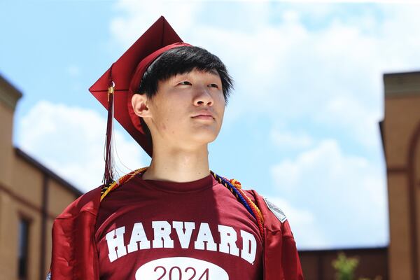 Henry Xuan poses for a portrait on Sunday, June 15, 2020, at Lambert High School in Suwanee, Georgia. Thousands of K-12 schools and colleges closed in the middle of the spring semester this year due to the coronavirus pandemic. For high school and college seniors, the closure not only meant the end of in-person classes, but also no traditional senior rituals like prom and graduation. 