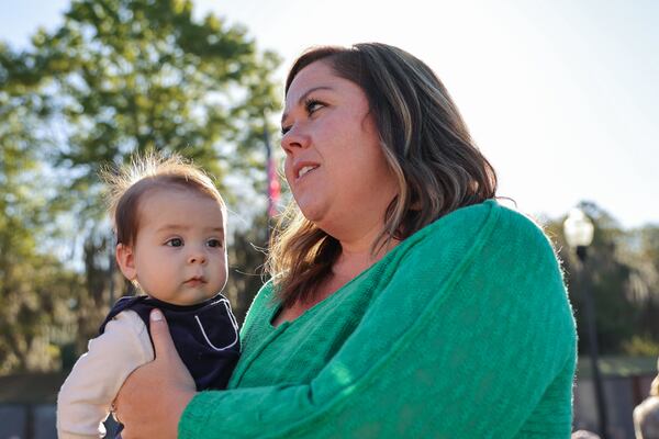 Meagan Danley and her five-month-old son William shown at the dedication of the Vietnam War Memorial Wall at the National Infantry Museum in Columbus. (Natrice Miller/ Natrice.miller@ajc.com) 