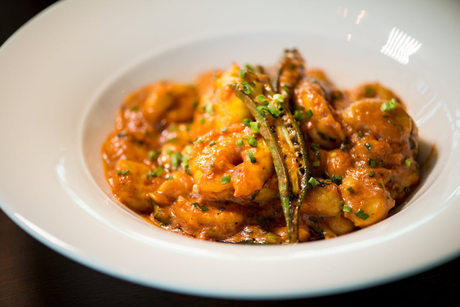  Coastal Piri-Piri Prawn starter, with potato gnocchi, grilled okra, and pomodorro. Photo credit- Mia Yakel.