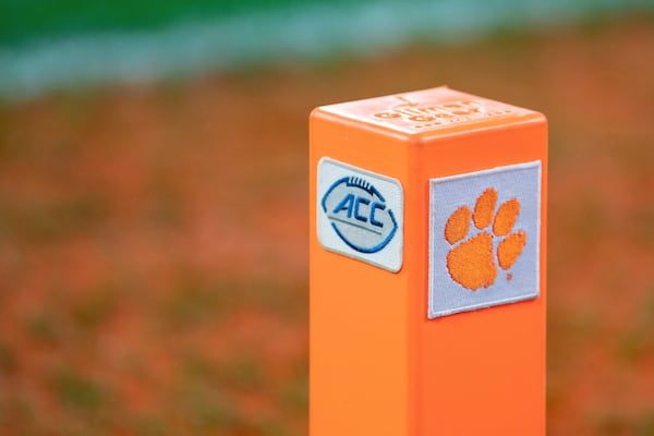 FILE - A Clemson and ACC logo are displayed on a pylon during an NCAA college football game between Clemson and North Carolina Saturday, Nov. 18, 2023, in Clemson, S.C. (AP Photo/Jacob Kupferman, File)