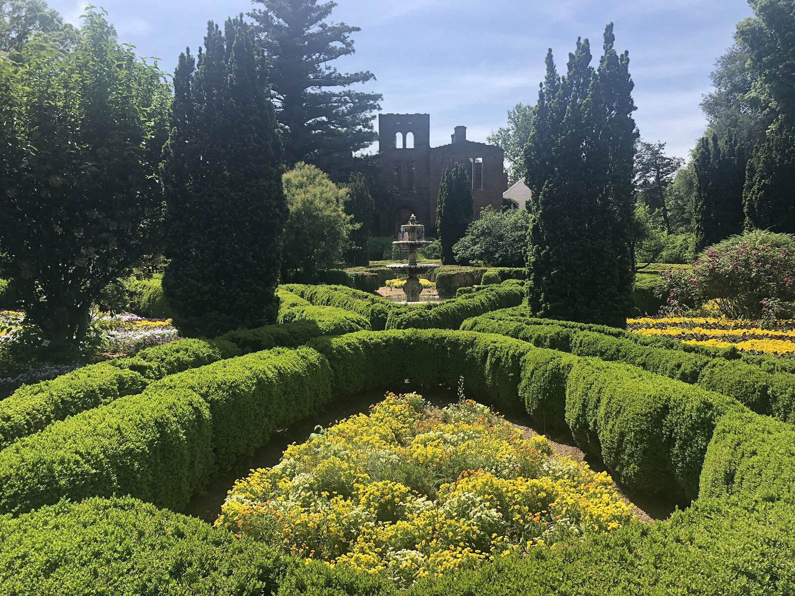 Throughout the parterre at Barnsley Resort, guests can spot multi-colored Iris, peonies, columbine, pink roses, white tea roses, pink and red flowering quince, crinum and blue asters. Contributed by Barnsley Resort/Liz Eads