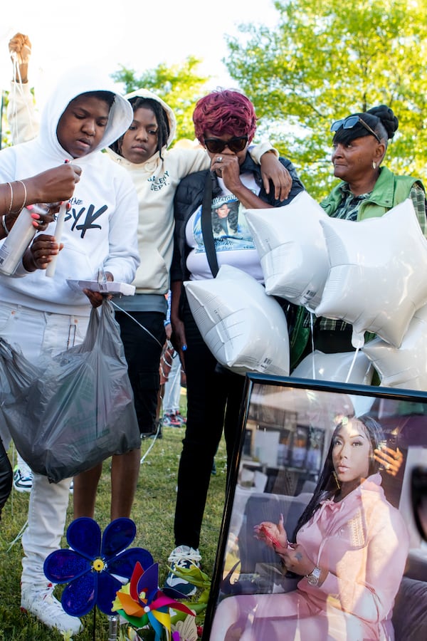 Family and friends pay their respects during the candlelight vigil for Koko Da Doll on Saturday, April 22, 2023, in Atlanta. Koko was a Black trans woman who was murdered this week and was the star of "Kokomo City," an upcoming documentary that highlights the experiences of trans sex workers that premiered at the Sundance Film Festival earlier this year. CHRISTINA MATACOTTA FOR THE ATLANTA JOURNAL-CONSTITUTION.