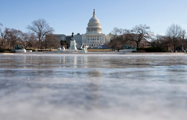 The reflecting pool in front of the U.S. Capitol building in Washington.  The House and Senate are in recess. (Evan Vucci /AP)