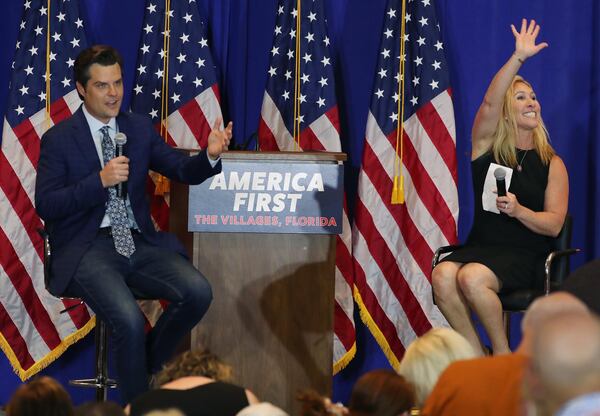 Florida Repubican U.S. Rep Matt Gaetz, left, and Georgia Republican U.S. Rep. Marjorie Taylor Greene speak at a May rally in Florida. The Put America First political action committee that funded their appearance across the country has seen its cash reserve dwindle, according to Mother Jones magazine. (Stephen M. Dowell/Orlando Sentinel/TNS)