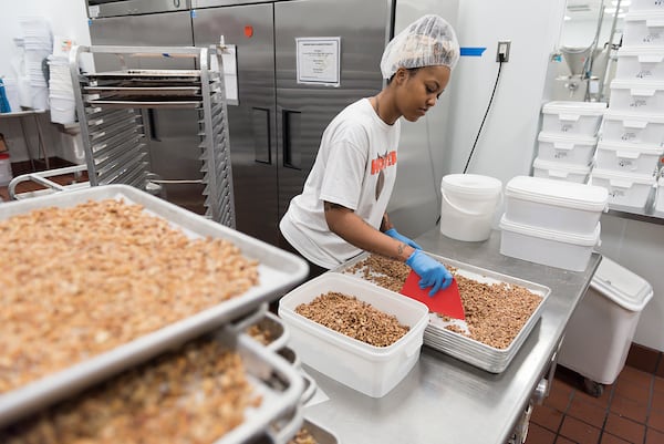 Tonya Millner, a master chef at High Road Ice Cream & Sorbet, chops pecans in High Road's kitchen in Marietta, Georgia (DAVID BARNES / SPECIAL)