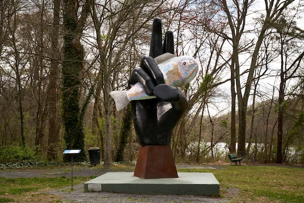 “Ask the Fish 2.0” shows man’s domination over man in a sculpture by Dr. Stephen Fairfield. The sculpture is located at the Don White Bridge at Ga. 400 in Roswell. 
Courtesy of Cultural Gorilla.