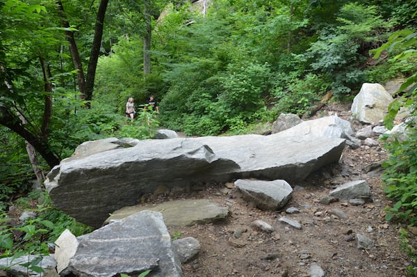 The mudslide that took out half of the large parking lot in 2018 has been scrubbed away, but a section of the popular Hickory Nut Falls Trail now incorporates a truck-size boulder that tumbled down the hill during the torrential rains. Contributed by Robert Nicholls