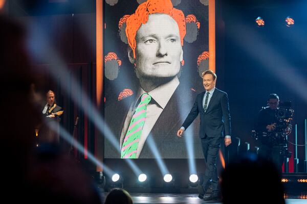 Comedian Conan O'Brien walks out on stage at the start of the 25th Annual Mark Twain Prize for American Humor Celebrating Conan O'Brien, Sunday, March 23, 2025, at the Kennedy Center for the Performing Arts in Washington. (AP Photo/Kevin Wolf)