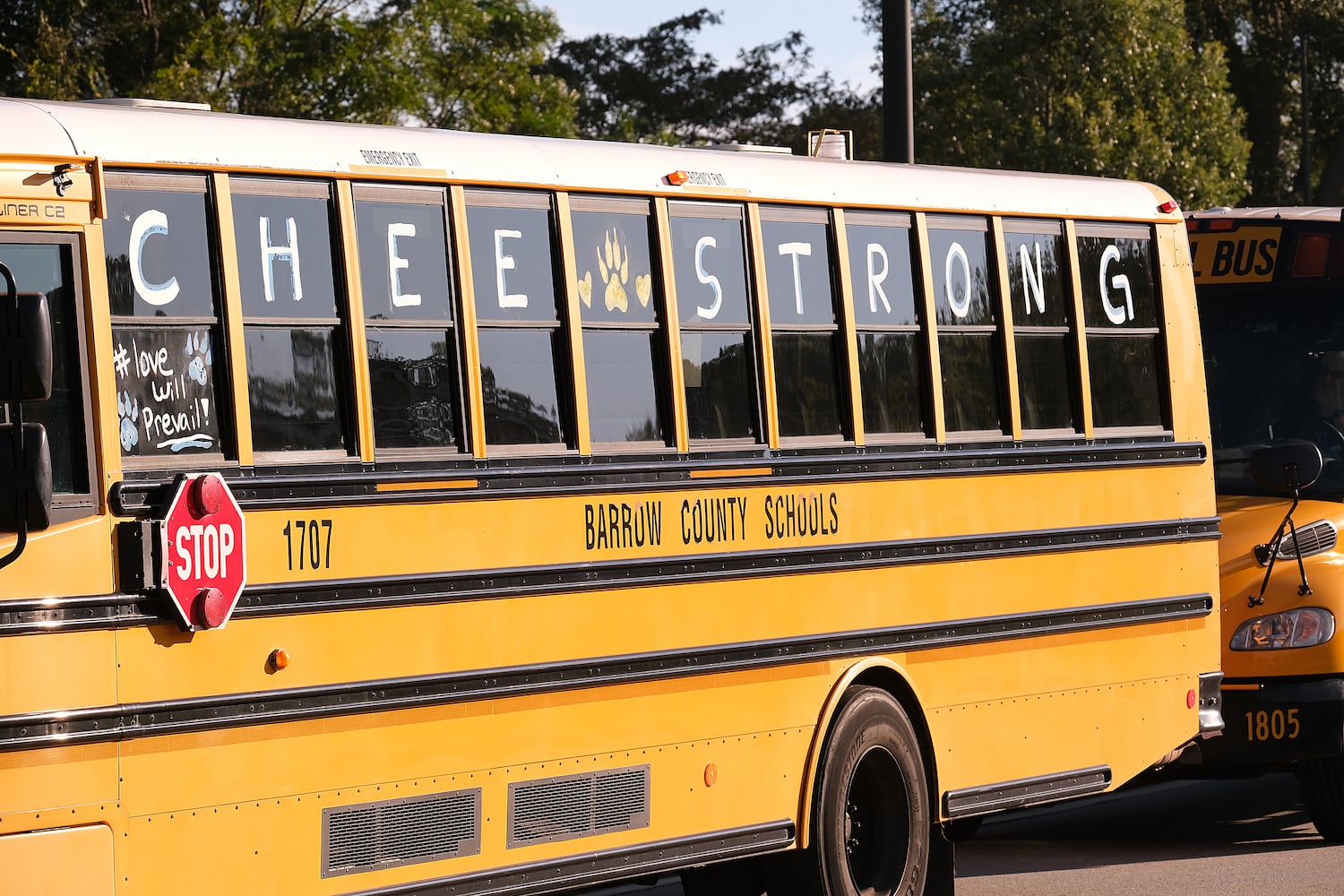 The team bus from Apalachee is parked outside the stadium with a message. Apalachee High School returned to the field against Athens Clark Central Saturday September 28, 2024 in their first game since the school schooting earlier in the month.

 Nell Carroll for the Journal Constitution