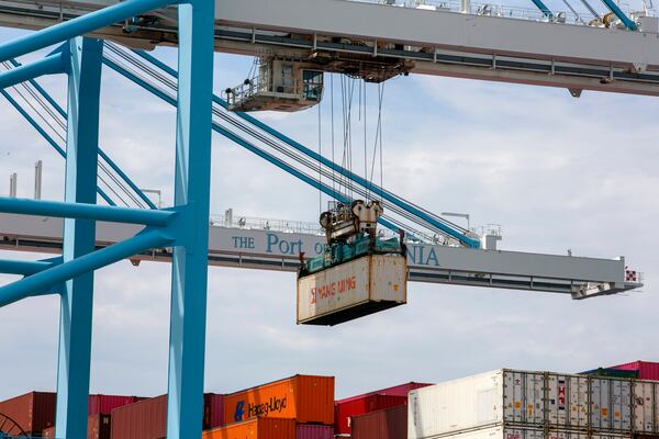 
                        Shipping containers are loaded onto a ship at the Port of Virginia in Norfolk, Va., Aug. 13, 2024. The Port of Virginia reveals what machines are capable of — and have been allowed to do under existing labor contracts. (Kristen Zeis/The New York Times)
                      