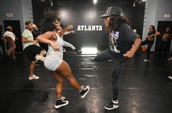 Yvonna Hoba (center left) and Lenataa Goka (center right) participate in Cece Herbert’s Afrodance class at Creative Rental Space, Thursday, October 17, 2024, in Atlanta. Cece Tor-Herbet is a popular Atlanta choreographer and influencer who specializes in African dancing. (Hyosub Shin / AJC)