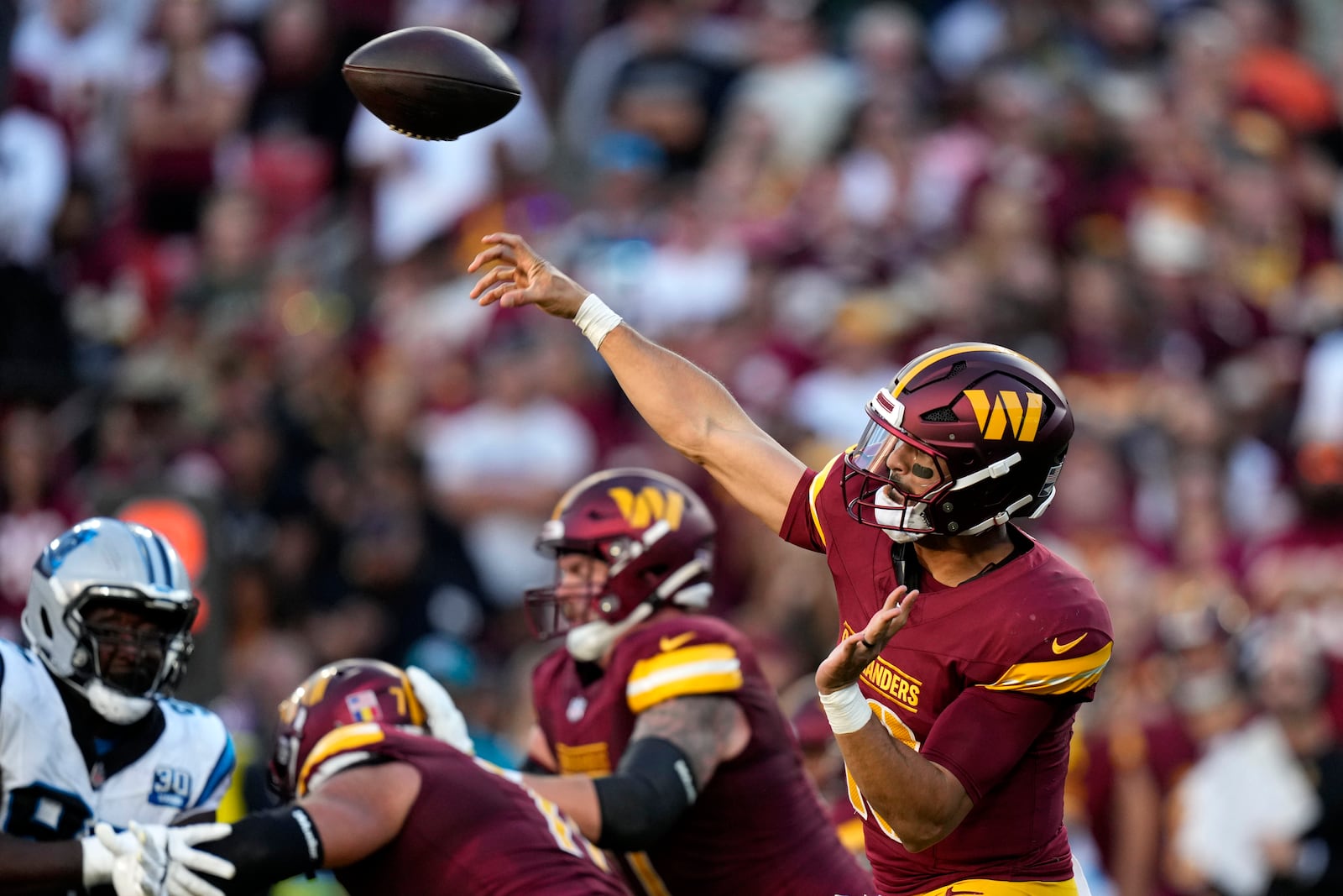 Washington Commanders quarterback Marcus Mariota throws a pass during the first half of an NFL football game against the Carolina Panthers, Sunday, Oct. 20, 2024, in Landover, Md. (AP Photo/Stephanie Scarbrough)