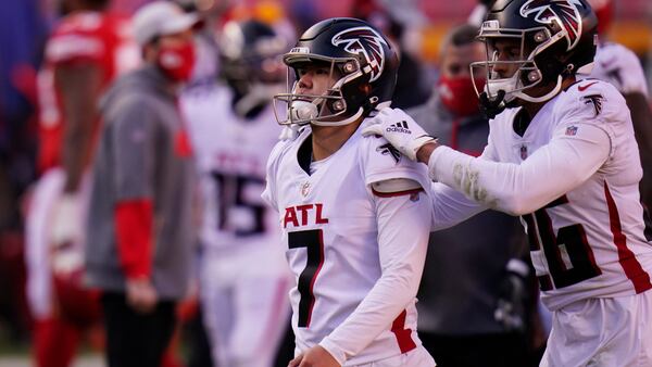 Atlanta Falcons place kicker Younghoe Koo (7) is consoled by teammate Isaiah Oliver after missing a game-tying 39-yard field goal in the closing seconds, Sunday, Dec. 27, 2020, against the Kansas City Chiefs in Kansas City, Mo. The Chiefs won 17-14. (Jeff Roberson/AP)