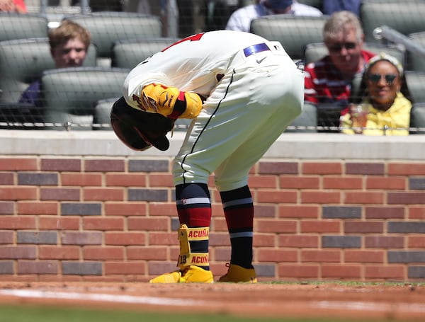 Braves outfielder Ronald Acuna is hit by a pitch from Arizona Diamondbacks pitcher Zac Gallen during the first inning of the first game of a doubleheader Sunday, April 25, 2021, at Truist Park in Atlanta. (Curtis Compton / Curtis.Compton@ajc.com)