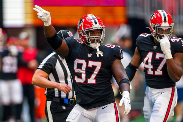 Atlanta Falcons defensive end Grady Jarrett (97) signals during the first half of an NFL football game against the San Francisco 49ers, Sunday, Oct. 16, 2022, in Atlanta. (AP Photo/Danny Karnik)