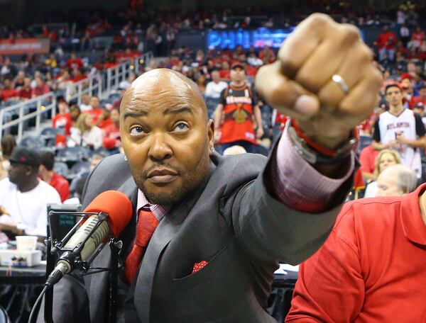 Hawks public announcer Ryan Cameron looks to bump knuckles with the officials taking the court at the opening of the first round home playoff game against the Nets on Sunday, April 19, 2015, in Atlanta.   Curtis Compton / ccompton@ajc.com