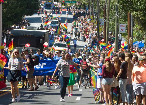 A large crowd lines 10th Street during the Atlanta Pride Parade In Atlanta on Oct. 9, 2016. (STEVE SCHAEFER / SPECIAL TO THE AJC)