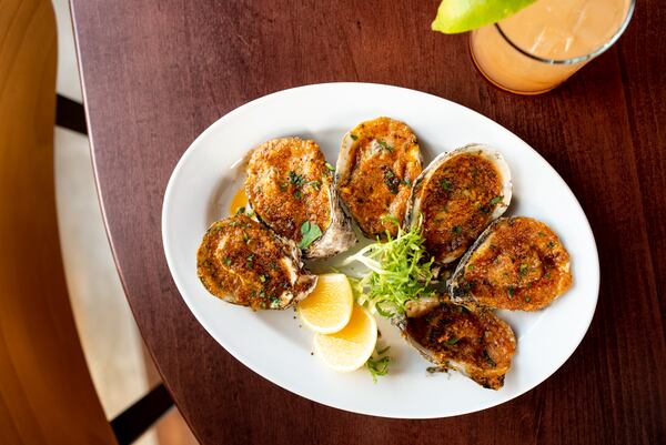 Lagarde grilled oysters with garlic butter and parmesan breadcrumbs.