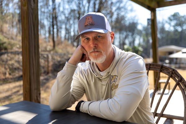 Now-former Apalachee High School football coach Mike Hancock posed for a portrait at his home in Monroe.