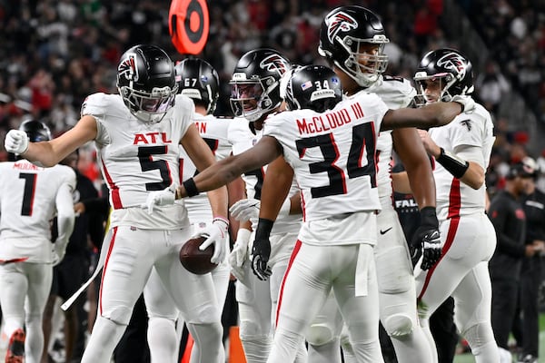 Atlanta Falcons wide receiver Drake London (5) celebrates his touchdown against the Las Vegas Raiders with teammates during the first half of an NFL football game, Monday, Dec. 16, 2024, in Las Vegas. (AP Photo/David Becker)