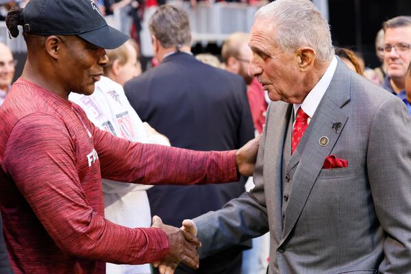 Falcons owner Arthur Blank shakes hands with former Falcons player Jessie Tuggle (58) moments before the Atlanta Falcons and Houston Texans game on Sunday, October 8, 2023, at Mercedes-Benz Stadium in Atlanta. 

Miguel Martinz/miguel.martinezjimenez@ajc.com