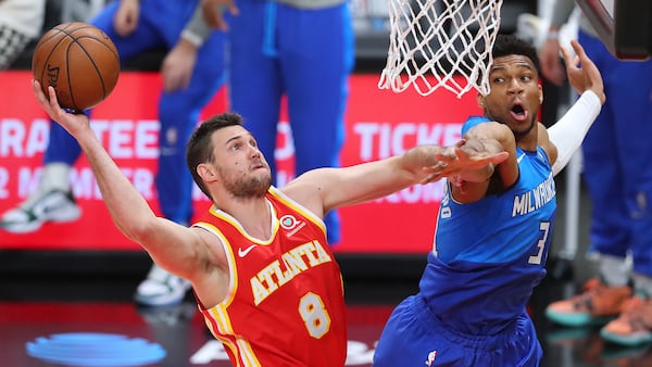 Danilo Gallinari drives to the basket against Giannis Antetokounmpo during the 2nd quarter in game 3 of the NBA Eastern Conference Finals on Sunday, June 27, 2021, in Atlanta.