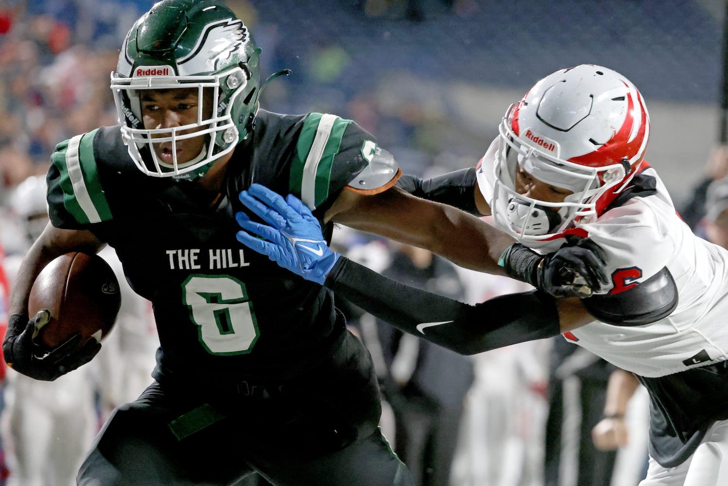 Collins Hill running back Spenser Anderson (6) scores a receiving touchdown against Milton defensive back Debron Gatling (6) during the first half of the Class 7A state title football game at Georgia State Center Parc Stadium Saturday, December 11, 2021, Atlanta. JASON GETZ FOR THE ATLANTA JOURNAL-CONSTITUTION