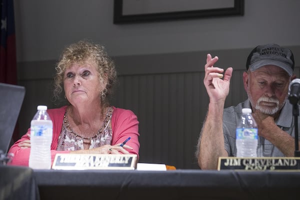 Mayor Theresa Kenerly (left) and City Councilman Jim Cleveland (right) during a city council meeting at the Hoschton Historic Train Depot in Hoschton, Monday, May 6, 2019. ALYSSA POINTER/ALYSSA.POINTER@AJC.COM