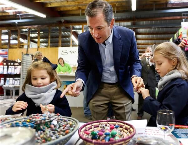 Republican presidential candidate Sen. Ted Cruz and daughters Catherine, left, and Caroline during a campaign stop. AP photo: Jim Cole