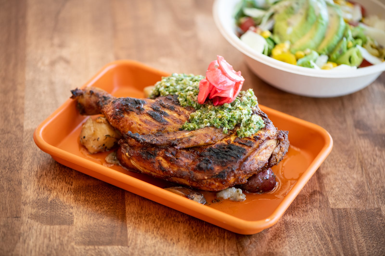 Karv Kitchen Half Rotisserie Chicken with chimichurri sauce. Mia Yakel for The AJC