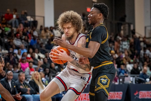 Jackson State guard Jayme Mitchell Jr. (3), left, fights for the ball against Alabama State during the first half of an NCAA basketball game in the championship of the Southwest Athletic Conference Championship tournament on Saturday, March 15, 2025, in College Park, Ga. (AP Photo/Erik Rank)