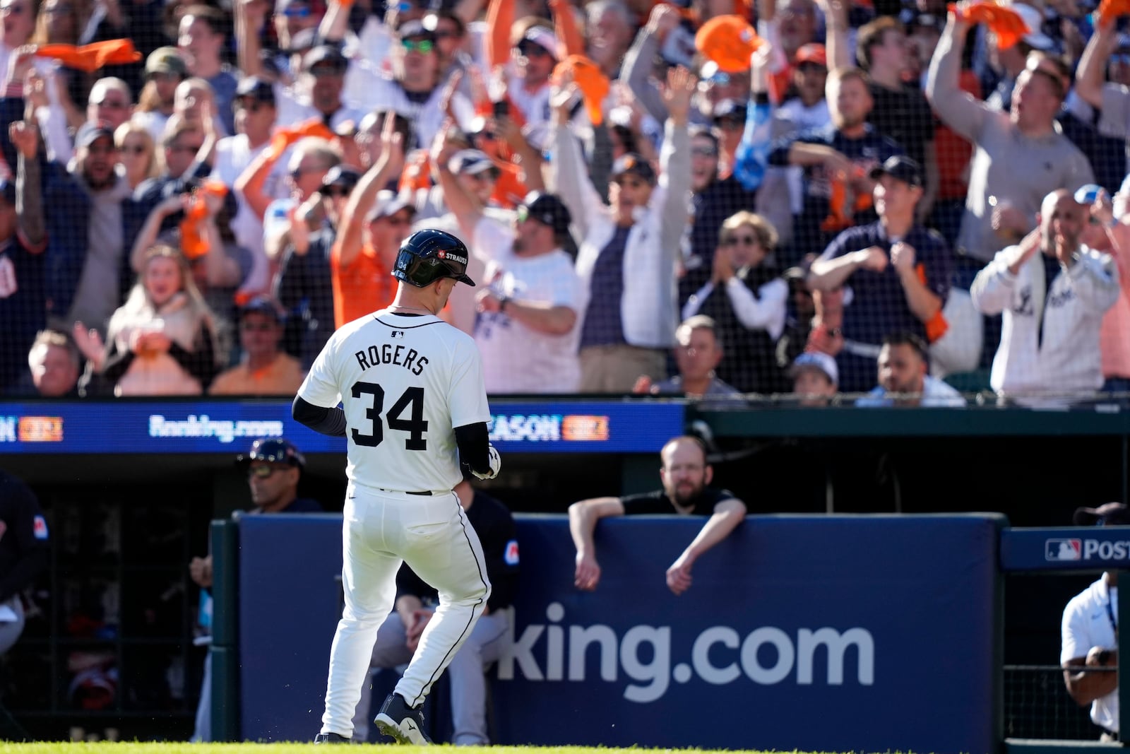 Detroit Tigers' Jake Rogers (34) scores on a sacrifice fly ball by Matt Vierling in the third inning during Game 3 of a baseball American League Division Series against the Cleveland Guardians, Wednesday, Oct. 9, 2024, in Detroit. (AP Photo/Carlos Osorio)