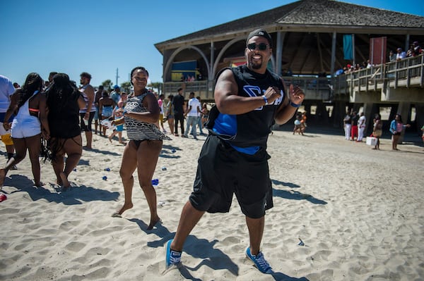 A couple dances near the Tybee Pier during Orange Crush in this file photo. (Photo Courtesy of Josh Galemore/Savannah Morning News)