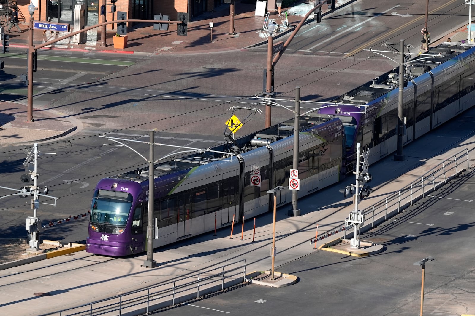 A Valley Metro Rail train moves pat Mill Ave. Tuesday, Sept. 24, 2024, in Tempe, Ariz. (AP Photo/Ross D. Franklin)