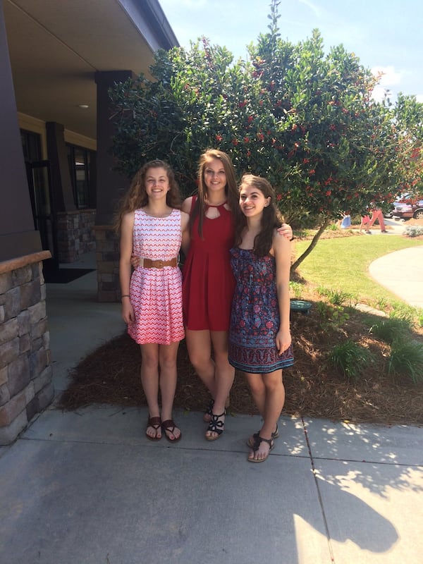 Jamison Clark with her sisters, Riley (middle), 15, and Mackenzie (right), 17. Jamison, who was severely attacked by a dog, decided to put her fear aside and collect donations for a shelter. CONTRIBUTED