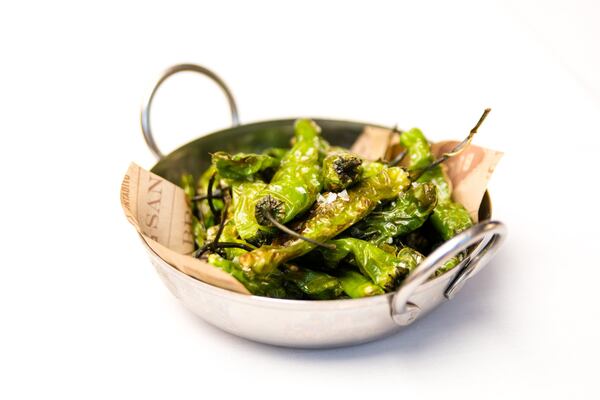 Bulla Gastrobar serves blistered shishito peppers simply dressed with oil and sea salt. CONTRIBUTED BY HENRI HOLLIS