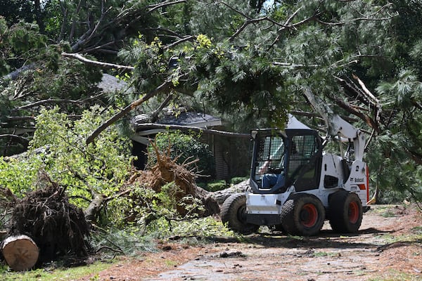 Crew clean up fallen trees after Helene's devastating march through Georgia. (Hyosub Shin / AJC)