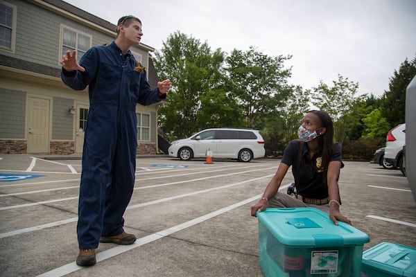 Asher Williams (left) speaks with Georgia Bureau of Investigation Crime Scene Specialist Daniella Stuart at ClearWater Academy in Tyrone on Tuesday, May 4, 2021. Stuart’s mother, Jenny, works at the school as a teaching assistant. (Alyssa Pointer / Alyssa.Pointer@ajc.com)