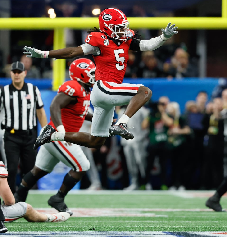 Georgia players react after Ohio State missed a field game to give Georgia the win at the end of the College Football Playoff Semifinal between the Georgia Bulldogs and the Ohio State Buckeyes at the Chick-fil-A Peach Bowl In Atlanta on Saturday, Dec. 31, 2022.  Georgia won, 42-41. (Jason Getz / Jason.Getz@ajc.com)