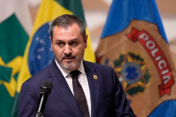 Federal police director Andrei Passos arrives to a news conference regarding an explosion outside the Supreme Court, in Brasilia, Brazil, Thursday, Nov. 14, 2024. (AP Photo/Eraldo Peres)