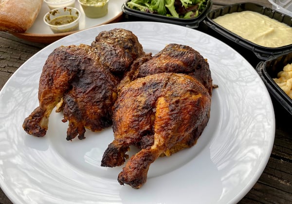 One of the two ways Fire Hen serves its rotisserie chicken is this whole bird marinated with garlic, herbs and chile peppers. Wendell Brock for The Atlanta Journal-Constitution