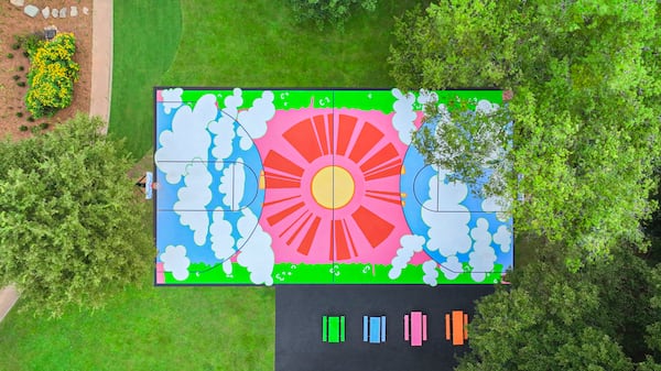 The Adair Park mural shows the sun sweeping away the clouds. Photo: Courtesy of SCAD