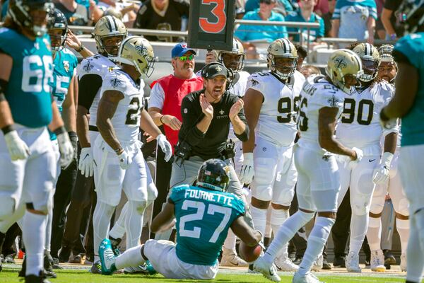 New Orleans Saints defensive line coach Ryan Nielsen celebrates a play against the Jacksonville Jaguars during the first half of an NFL football game, Sunday, Oct. 13, 2019, in Jacksonville, Fla. (AP Photo/Stephen B. Morton)