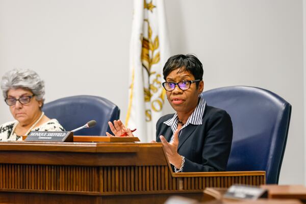 District Four Commissioner Monique Sheffield (right) is seen at a Cobb County Board of Commissioners meeting in Marietta on Tuesday, September 27, 2022.   (Arvin Temkar / arvin.temkar@ajc.com)