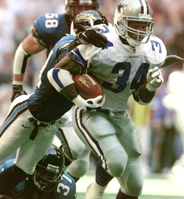 Herschel Walker, shown here on Oct. 19, 1997, retired from the Dallas Cowboys in 1998. Soon after leaving football, he began to experience mental health problems.. (AP Photo/Ron Heflin)