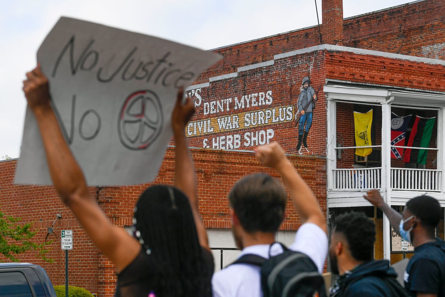 Photos: Protest at Wildman’s Confederate store in Kennesaw