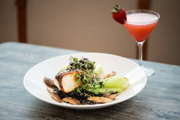  Pan Crisped Chilean Sea Bass with bok choy, shiitakes, forbidden black rice, miso-sake broth. Photo credit- Mia Yakel.