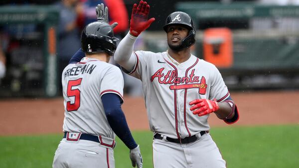 Braves' Jorge Soler (right) celebrates his home run with Freddie Freeman (5) during the fourth inning Sunday, Aug. 22, 2021, against the Orioles in Baltimore. (Nick Wass/AP)