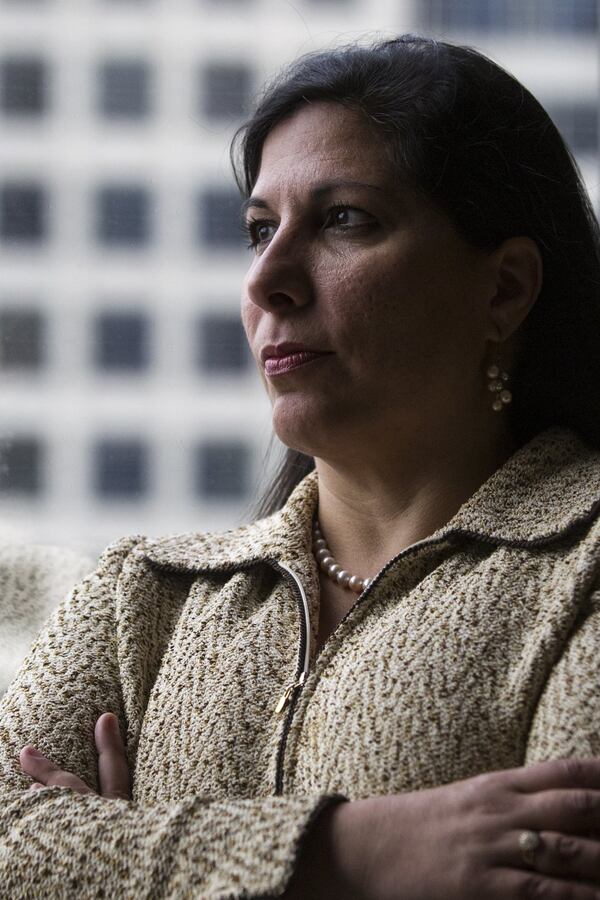 Attorney Amanda Farahany, 46, poses for a portrait in an office at Barrett & Farahany, LLP in downtown Atlanta, on Wednesday, Nov. 1, 2017. Farahany, who became a lawyer in 1998, specializes in cases dealing with sexual harassment. Farahany says that in 99 percent of her cases, the plaintiff is a woman and the defendant is a man, with only two cases in her 19-year career involving a male plaintiff and female defendant. “I keep beating my head against the wall hoping the wall is going to break,” Farahany says. (CASEY SYKES, CASEY.SYKES@AJC.COM)